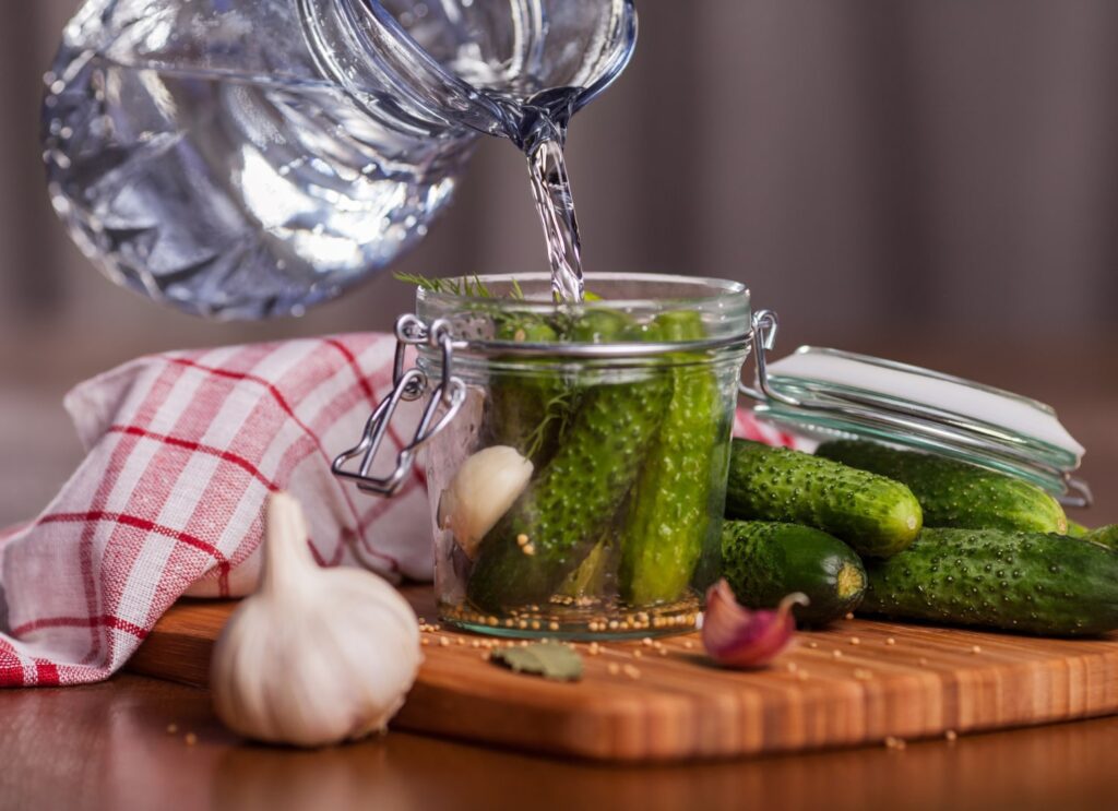 Pour the hot brine over the vegetables