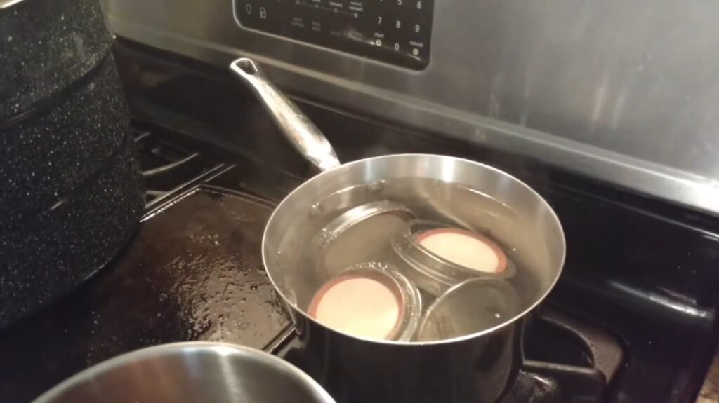 Proper boiling lids while sterlizing to guarantee top quality food jars