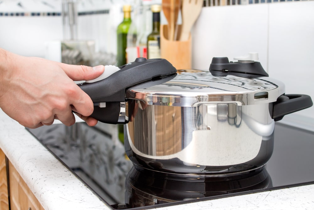 how to can without a canner fill water to the stockpot,put it on stovetop and fill the jars into the stockpot