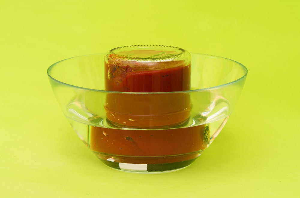 how to open a canning jar upside-down the jar in warm water and wait the magic