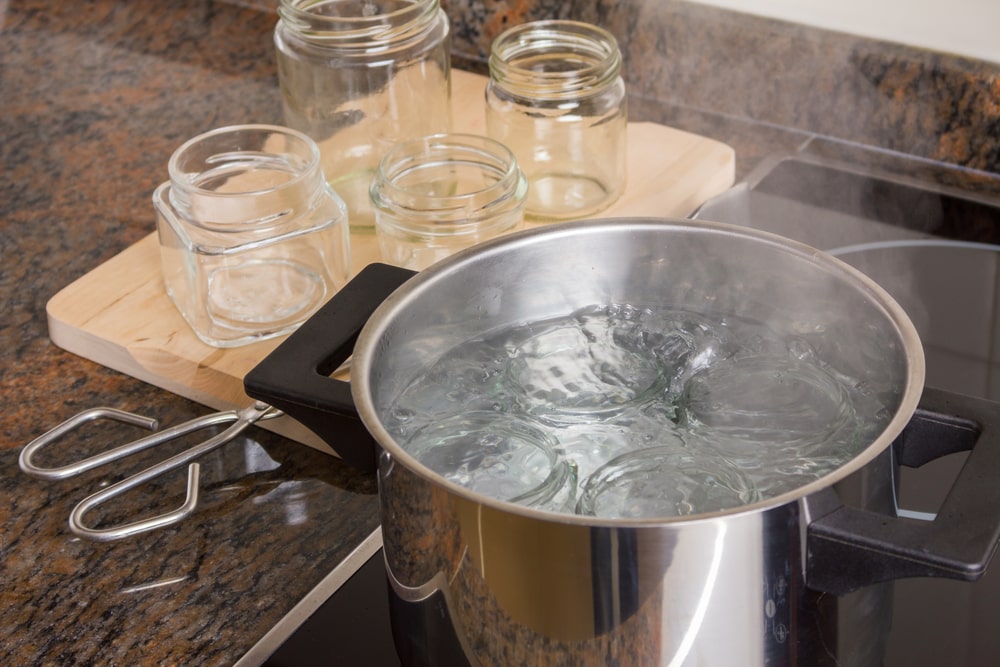 To guarantee the top-notch quality of your food jars, be sure to sterilize them before commencing the canning process