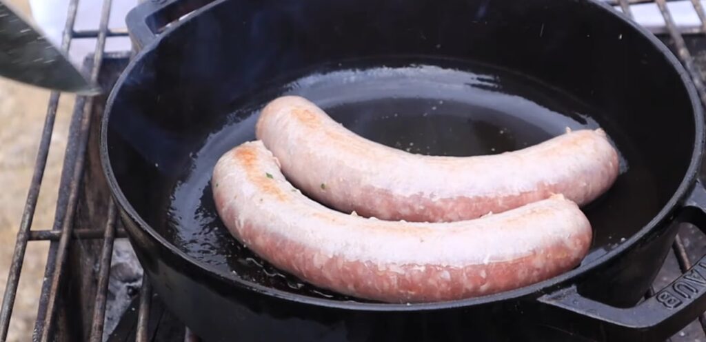 catalan sausage and beans frying the sausage with olive oil because virgin olive oil has positive effects on our health