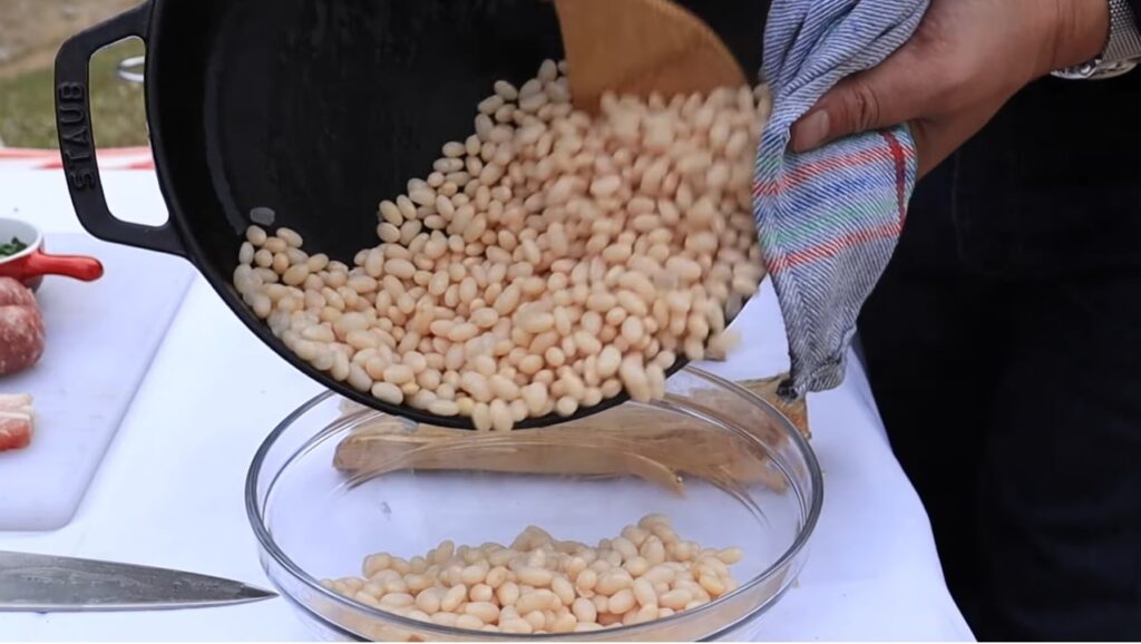 catalan sausage and beans  strain out all the water and place the white beans in a separate container