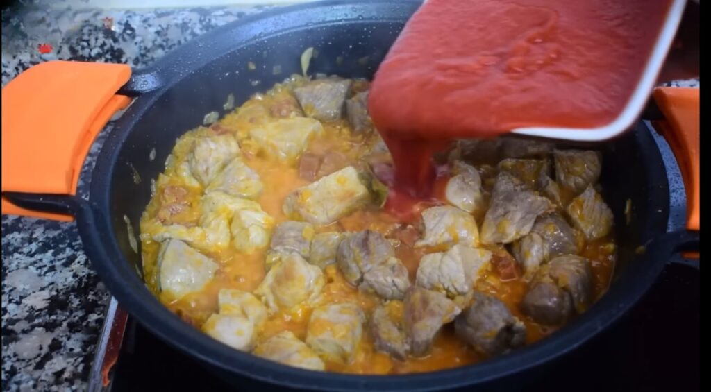 chili in spanish pour in the pre-prepared crushed tomatoes