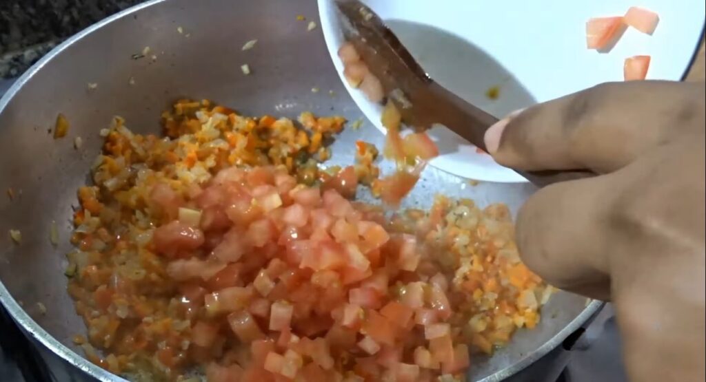 frijoles blancos add diced tomatoes prepared in the prepping steps