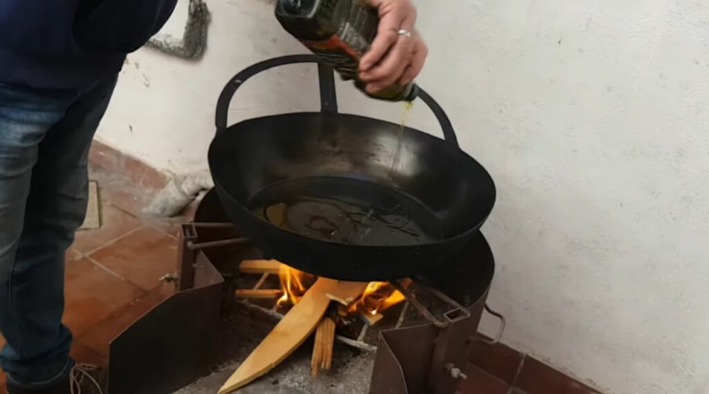 gachamiga you must have a very large pan, then pour olive oil in and start heating it