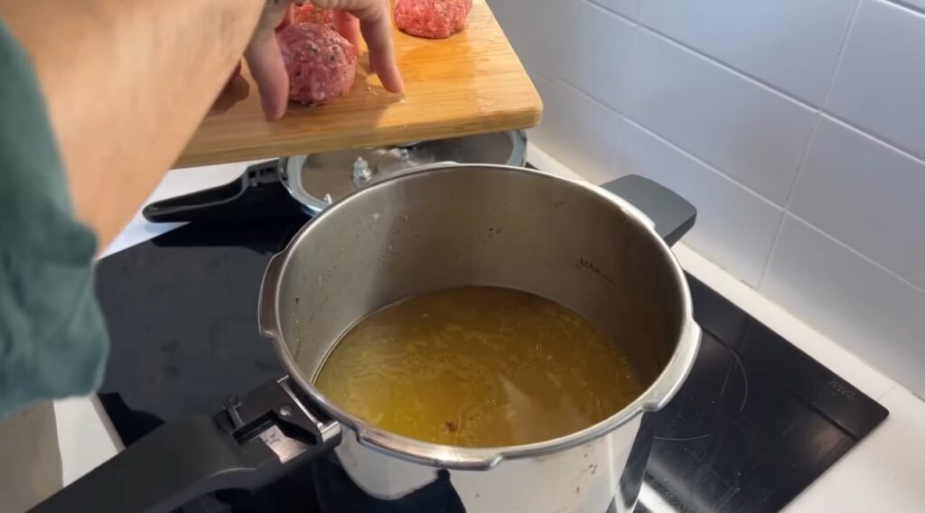 galets put the prepared juicy meatballs in the broth pot