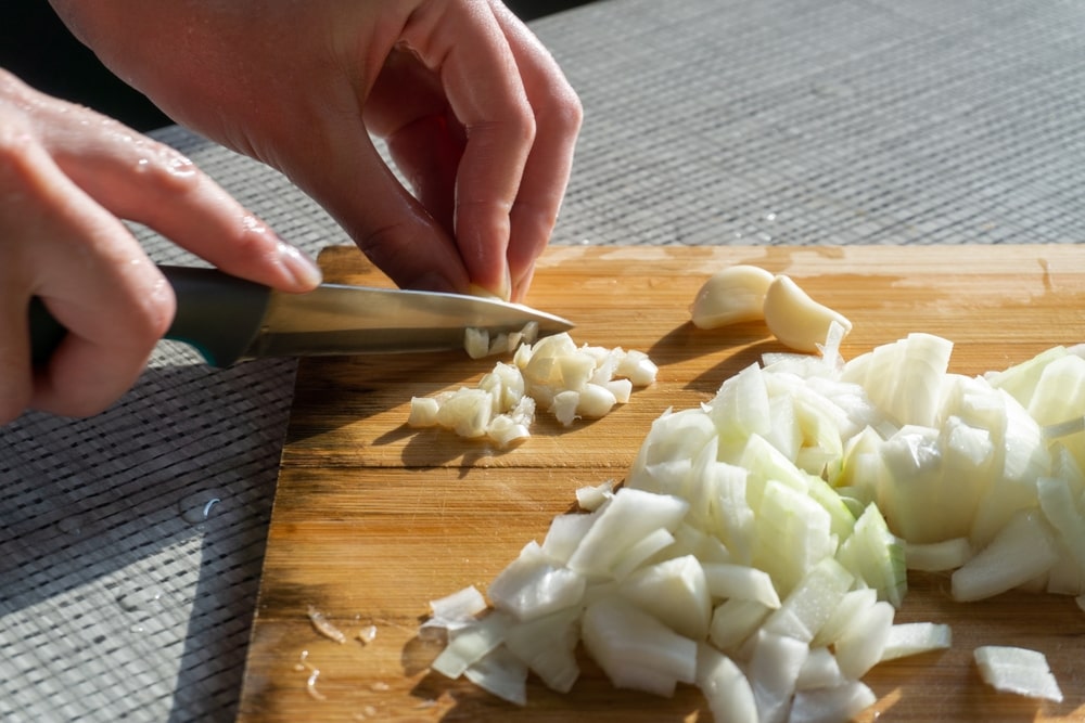garbanzo frito recipe chop onions and garlic into dice shapes for the onions and finely mince the garlic