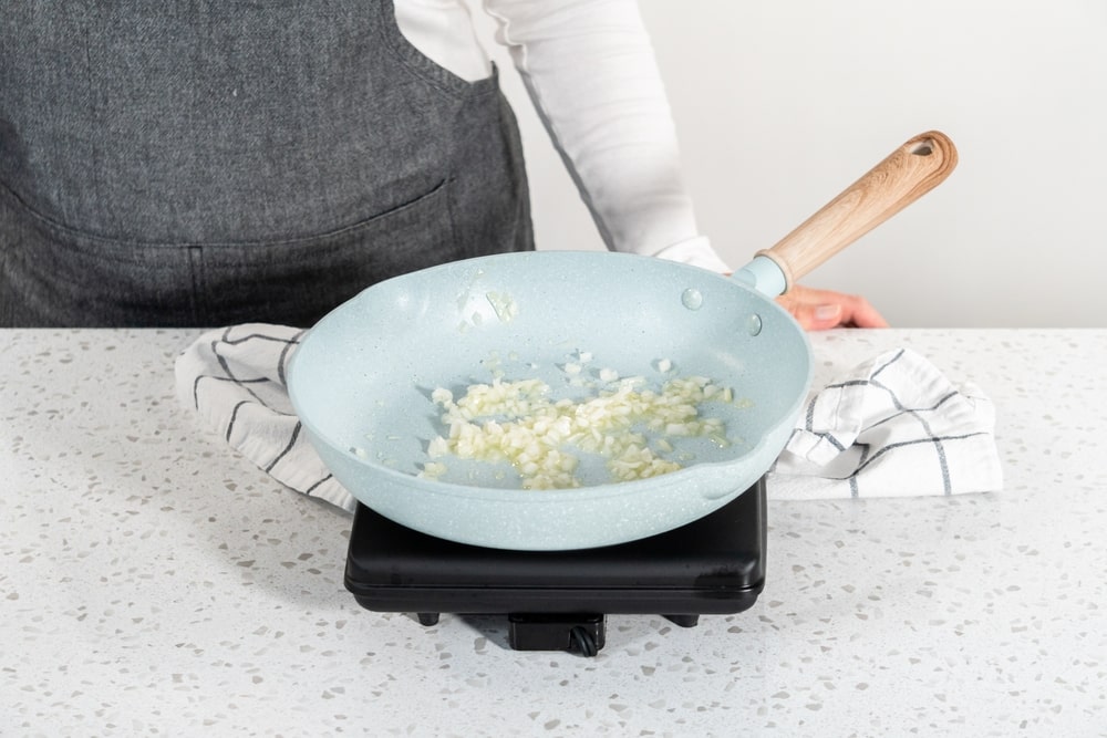 olla gitana adding salt while frying onion with olive oil will increase the flavor and fasten the progress